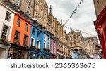 Victoria Street with its medieval houses and shops with brightly colored facades, Edinburgh, Scotland.