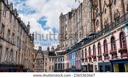 Victoria Street with its medieval houses and shops with brightly colored facades, Edinburgh, Scotland.