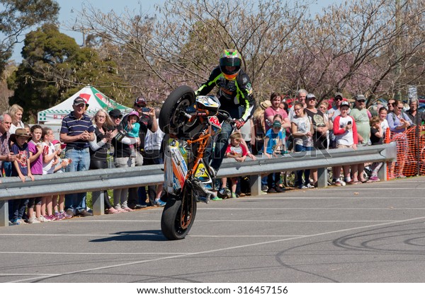 VICTORIA/AUSTRALIA - 13 SEPTEMBER 2015: Stunt\
motorcycle rider performing at a local car show on the 13 September\
2015 in\
Corowa.