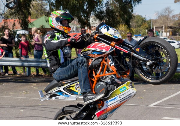 VICTORIA/AUSTRALIA - SEPTEMBER 2015: Stunt\
motorcycle rider performing at a local car show on the 13 September\
2015 in\
Corowa.