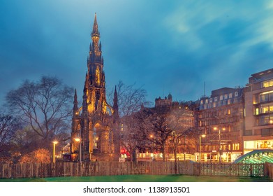The Victorian Gothic building of Scott Monument to Scottish author, Sir Walter Scott, in Princes Street Gardens in old town Edinburgh, Scotland, UK, being lit up at night
