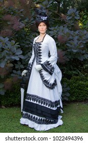 Victorian Lady In Bustle Dress With Parasol