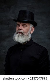 Victorian Old Man Dressed In Black Suit And Top Hat