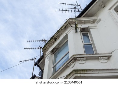 Victorian property with bay window and numerous TV aerials on the roof