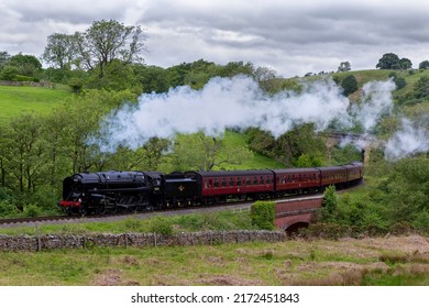 Victorian Steam Train Crossing Through North Yorkshire Countryside