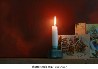 Victorian Styled Christmas Cards Set On A Mantle Piece With A Candle Against A 'grunge' Style Background. Mood Evocative Shot, Victorian In Feel. Copy Space Available.