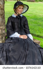 Victorian Woman In Black Dress And Bonnet