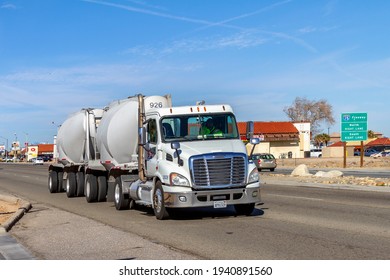 Victorville, CA, USA – March 17, 2021: A White Apex Bulk Commodities Semi Truck Traveling On Bear Valley Road In Victorville, California. 