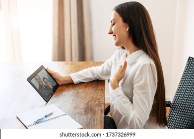 Video Appointment Online With Family Psychologist, Doctor. A Woman In Formal White Shirt Is Communicating Via Video With A Couple On The Tablet Screen. Video Meeting