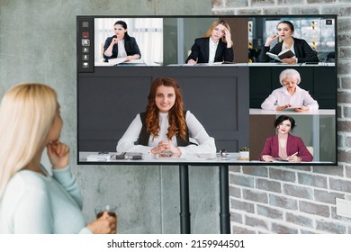 Video Briefing. TV Conference. Corporate Telecommuting. Female Business Team Discussing Strategy Plan Working Online In Digital Office On Screen.