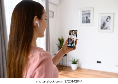 Video call, video chat. A girl is using smartphone for online video communication with friends