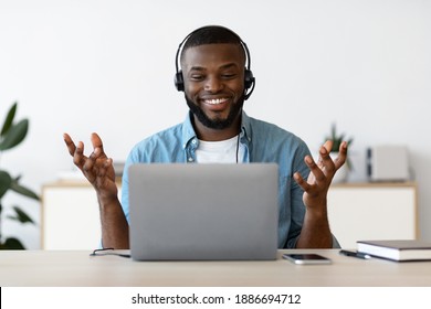 Video Call. Cheerful African American Man In Headset Having Online Meeting With Laptop At Home, Smiling Black Freelancer Guy Making Web Conference On Computer, Enjoying Online Communication