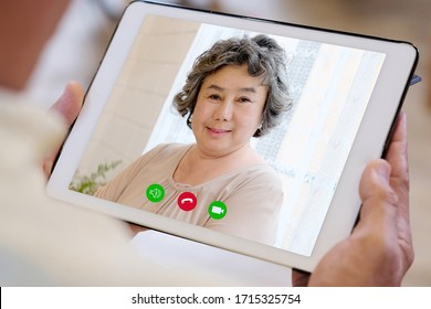 Video Call Conference, Asian Senior Woman Having A Video Chat On Digital Tablet, Mobile Phone At Home, Asia Elderly Female Talking Video Call On A Smartphone, Old People Using Online Telecommunication