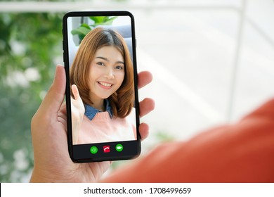 Video Call Conference, Happy Girl Having A Video Chat On Mobile Phone At Home, Asian Woman Talking Video Call On A Smartphone, Female Using Online Telecommunication, Social Distancing 