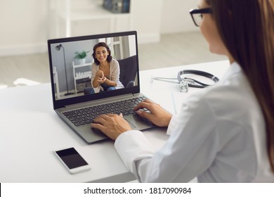 Video call to doctor online. Woman patient uses web application of medical clinic has laptop talking to doctor at home. Medical assistance of the virtual clinic. - Shutterstock ID 1817090984