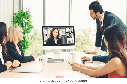 Video Call Group Business People Meeting On Virtual Workplace Or Remote Office. Telework Conference Call Using Smart Video Technology To Communicate Colleague In Professional Corporate Business.