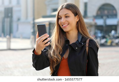 Video Call. Transfer Student Using Phone For Internet Call In City Street.