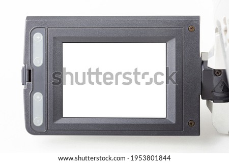 Video camcorder film camera movie recorder blank, empty white flip out screen, digital display cut out, object detail closeup, place for own picture, photo. Retro video recording concept, nobody