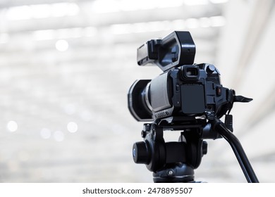 Video camera with blur background for journalist interview broadcasting reporter news or press conference speaker or public speaking or meeting report record and content creator live media concepts.