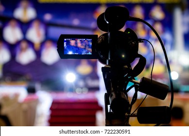 Video Camera In Business Conference Room Recording Participants And Speaker