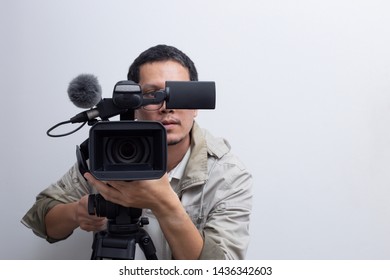 The Video Camera Operator Is Recording The Event On White Background.