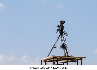 A Video Camera Operator Who Works With His Device To Perform Live And Gives The Videographer A Video Recording Of Sporting Events In The Stadium On A Bright Summer Sky Background.
Camcorder Available