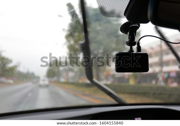 video camera\
recorder inside car driving rainy\
day