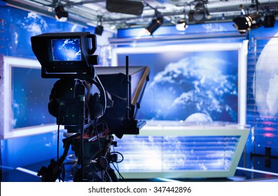 Video camera - recording show in TV studio - focus on camera