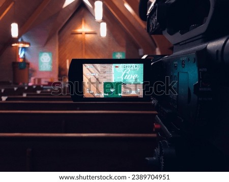 Video camera recording worship service in Christian church sanctuary