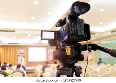 Video camera set record audience in conference hall seminar event. Company meeting, exhibition convention center, corporate announcement, public speaker, journalism industry