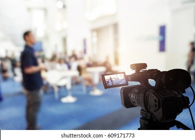 Video camera taking live video streaming at event background - Shutterstock ID 609171773