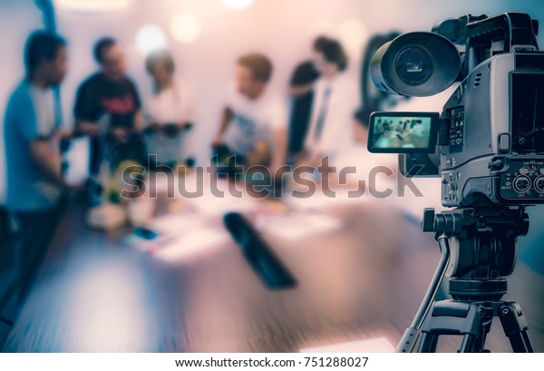 Video camera taking live video streaming at
people working background