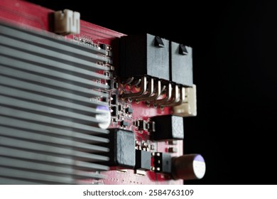 Video card. Processor core detail. Board, Details, Electronic circuit and video card chip. Cooling stabilizer. Close-up. Partially blurred photo.