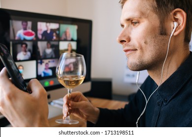 Video Conference Party Online Meeting With Friends And Family. Birthday Party In Facetime Call. Parties During Coronavirus Quarantine Long Distance Celebration. Glass Of White Wine In Holding Hand.