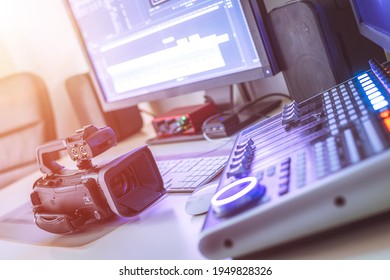 Video editing, recording and cutting room with monitors, camera and sound mixing desk - Shutterstock ID 1949828326