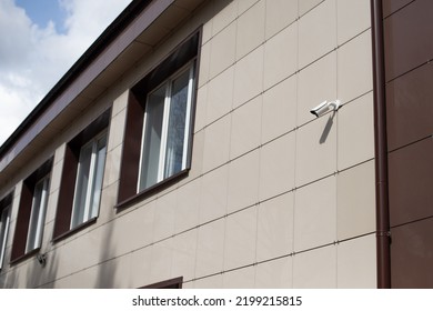 Video Equipment, Surveillance Camera On The Wall Of The House To Control The Outdoor Security System Zone.