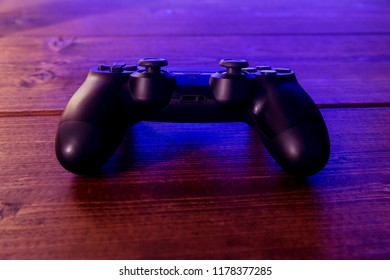 Video game controller at night with lights