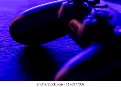Video game controller at night with lights