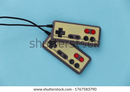 Video game Gamepads. Gaming concept. Top view two retro joysticks on blue background. Flat lay