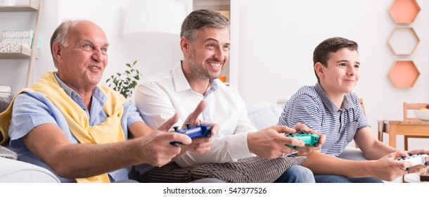 Video Games Competition In Family Between Men From Different Generations