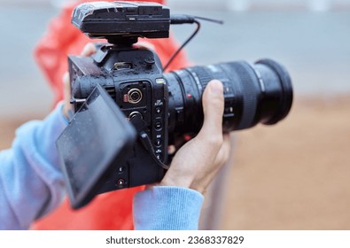 Video Making with the stabilizer. Man recording a video with a slr camcoder.