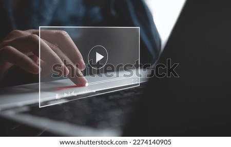Video marketing concept. Woman playing video content online streaming, running short clip on laptop computer. Marketing technology and advertising for  online business, internet network