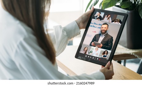 Video Presentation. Web Conference. Professional Telecommuting. Female Corporate Team Watching Male Business Colleague Online Report On Tablet Screen.