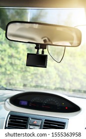 video recorder under view mirror in car, camera for recorder when driving - Shutterstock ID 1555363958