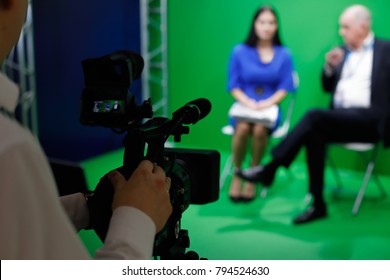 Video Recording Of An Interview In Tv Green Screen Studio. Selective Focus.