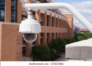 Video Security Camera Housing Mounted High On College Campus