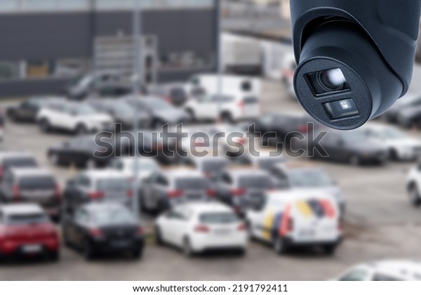 Video\
surveillance camera installed on a vehicle\
parking.