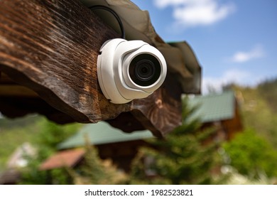 Video Surveillance Camera Placed On A Wooden House