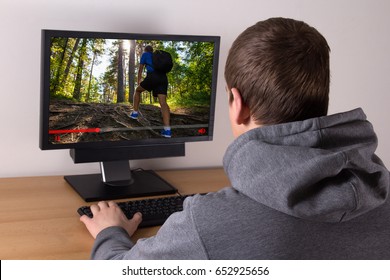 video travel blog concept - young man watching video at home