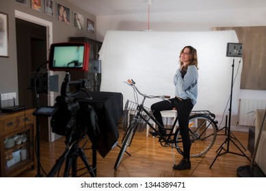 Videoblogger working on creating her videos - Shutterstock ID 1344389471